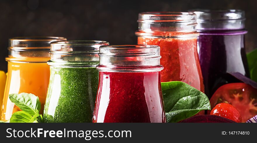 Colorful Vegetable Juices And Smoothies From Tomato, Carrot, Pepper, Cabbage, Spinach, Beetroot In Bottles On Kitchen Table, Vegan