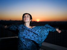Woman, Sunset In A City And Dusk Blue Sky Stock Photo