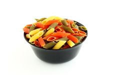Colored Pasta In Black Bowl Stock Images