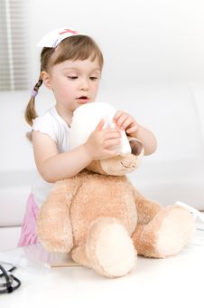 Little Girl Doctor With Teddy Bear Stock Photos Little Girl Doctor With Teddy Bear Stock Photos