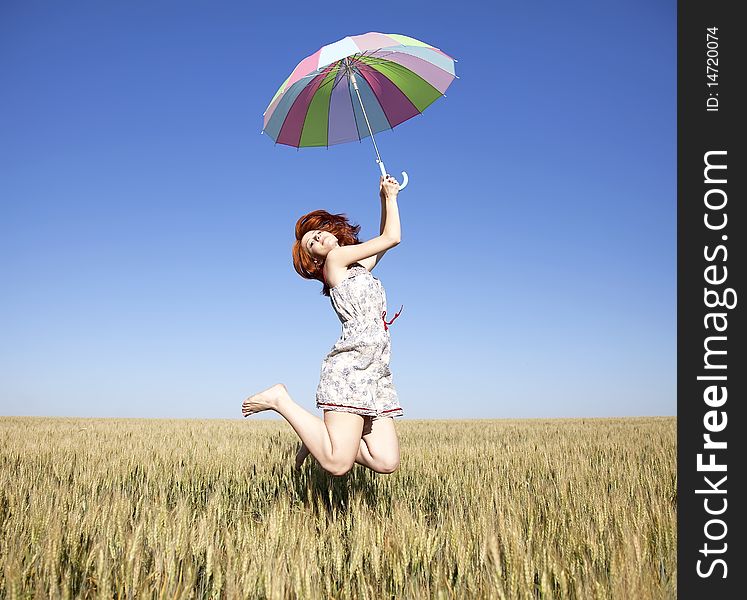 GIrl with umbrella at field