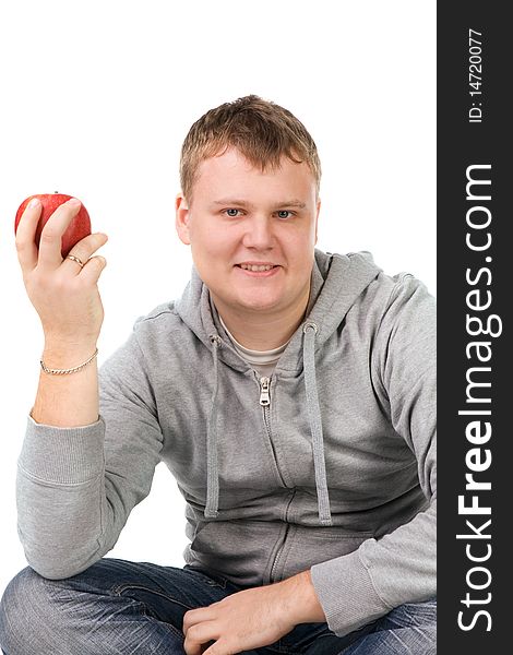 Portrait of a young man with apple, isolated on white