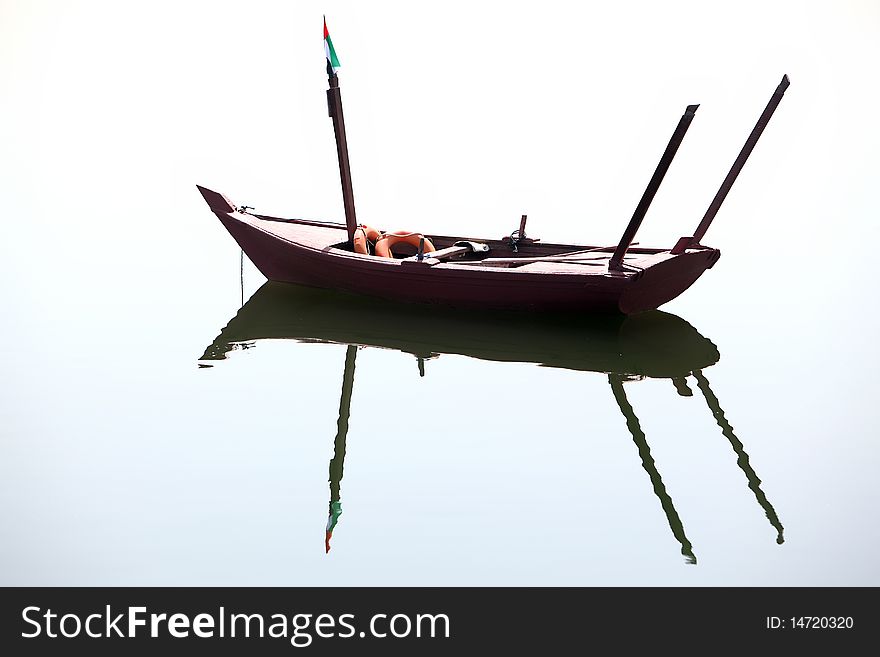 Boat ( arabian gondola ) with reflection at water
