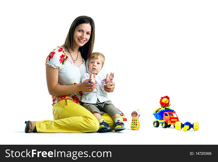 The portrait of a little boy and his mother playing with toys