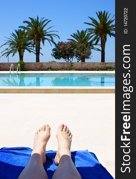 Girl foot at swimming pool