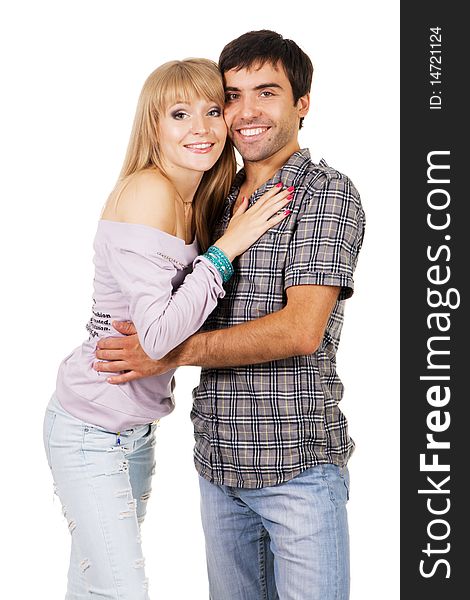 Romantic young couple in casual clothing, white background. Romantic young couple in casual clothing, white background