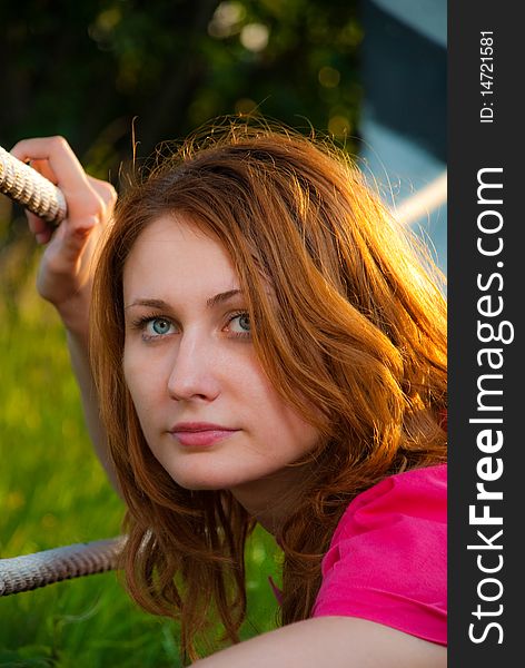 Redhead woman portrait at roadside sunset. Redhead woman portrait at roadside sunset