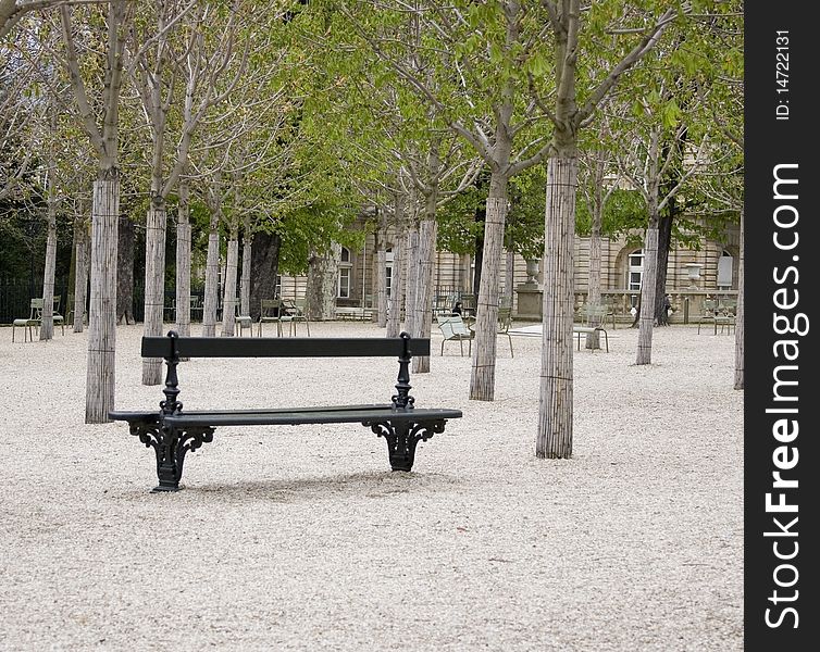 A bench in the Jardin du Luxembourg in Paris, France. A bench in the Jardin du Luxembourg in Paris, France