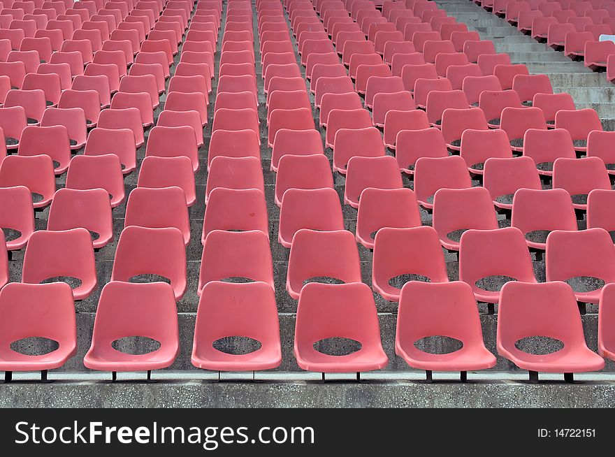 Many Empty Seats In Rows In An Outdoor Stadium. Many Empty Seats In Rows In An Outdoor Stadium