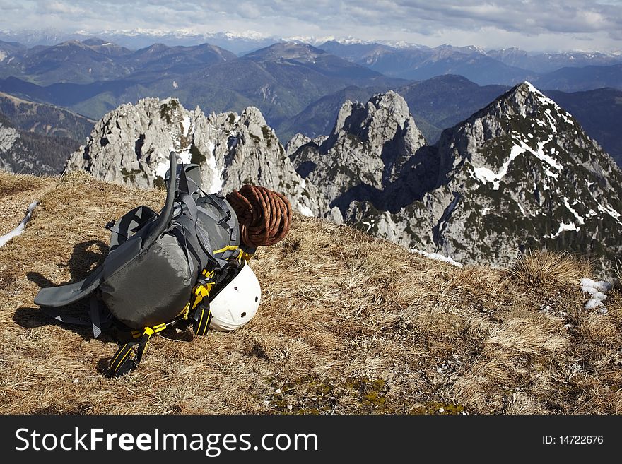 Mountains and backpack with helmet from a climber. Mountains and backpack with helmet from a climber