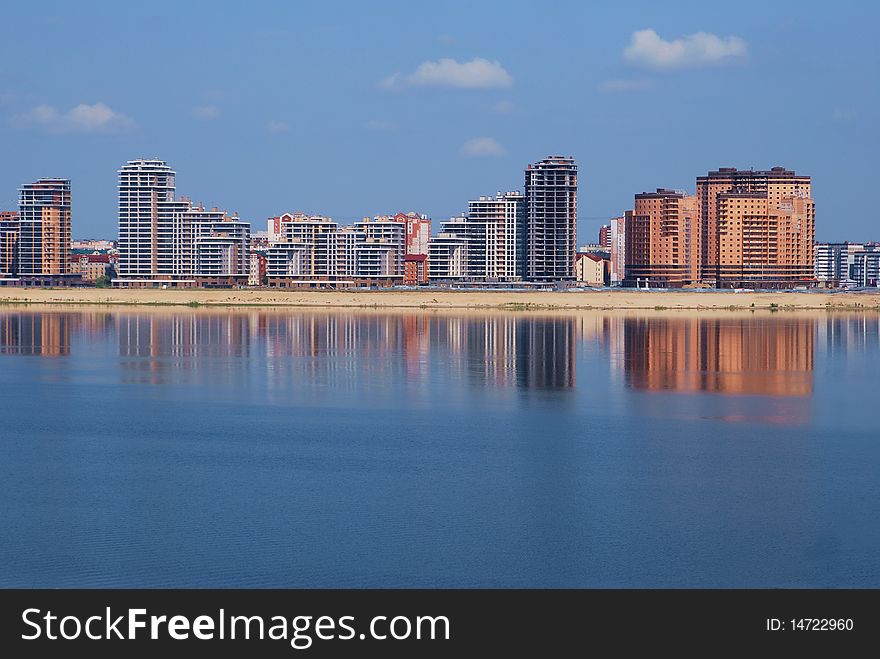 New buildings on the river embankment.