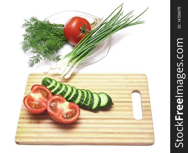 Tomatoes and cucumbers on the cutting board