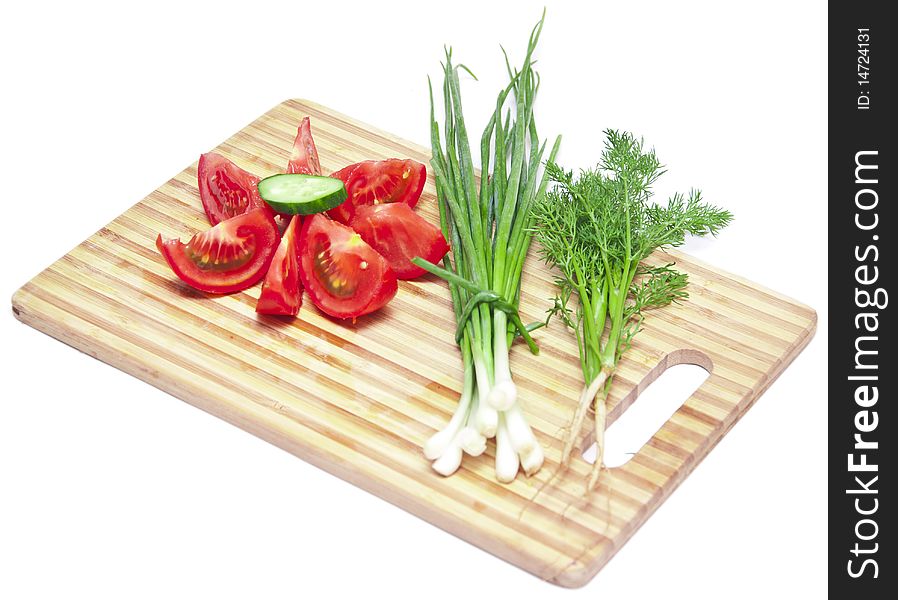 Tomatoes and cucumbers on the cutting board