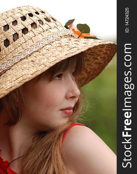 Portrait of young model in a straw hat. Portrait of young model in a straw hat