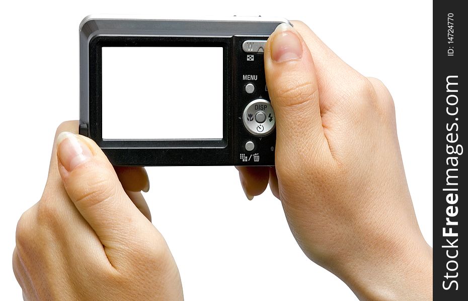 The digital camera with the white screen in hand on white background. The digital camera with the white screen in hand on white background