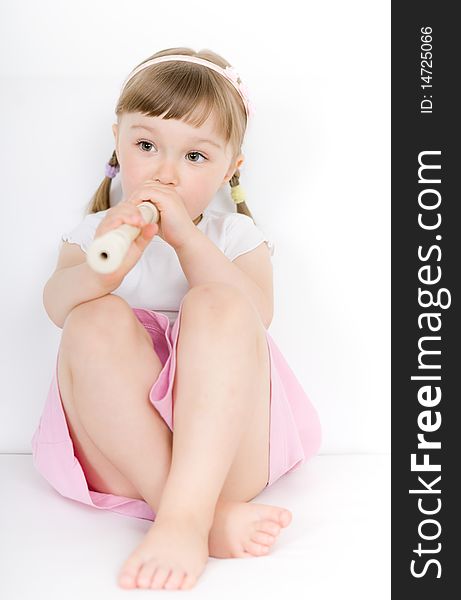 Sweet happy little girl with instrument