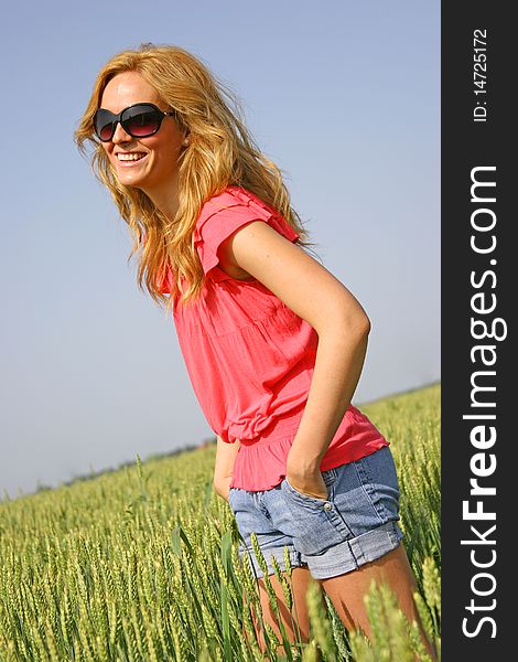 Beautiful sexy girl in a wheat field