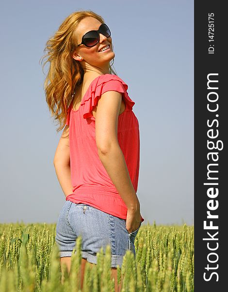 Sexy girl in a wheat field