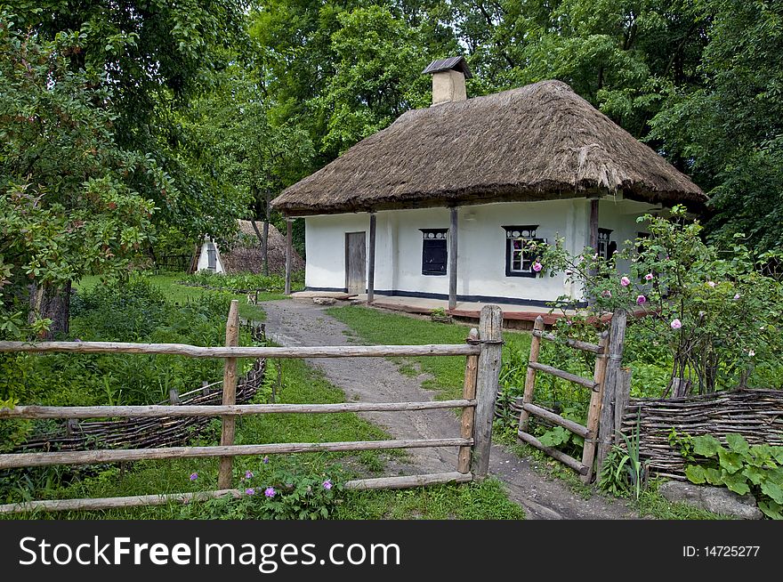 Ukraine. Outdoor museum of historic architecture and household. Old wooden house with yard. Ukraine. Outdoor museum of historic architecture and household. Old wooden house with yard..