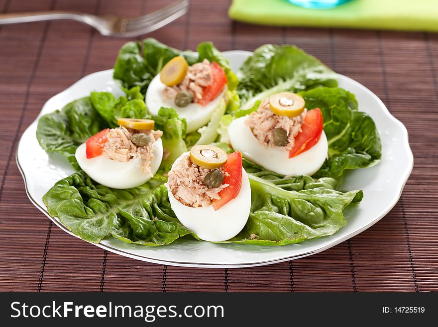 Salad plate of letuce egg tuna and olive. Salad plate of letuce egg tuna and olive