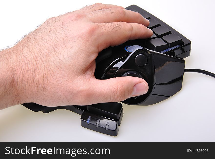 Black joystick and keypad with gamer hand on it