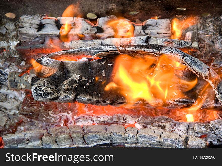 Decaying coals lay and turn to ashes. Decaying coals lay and turn to ashes