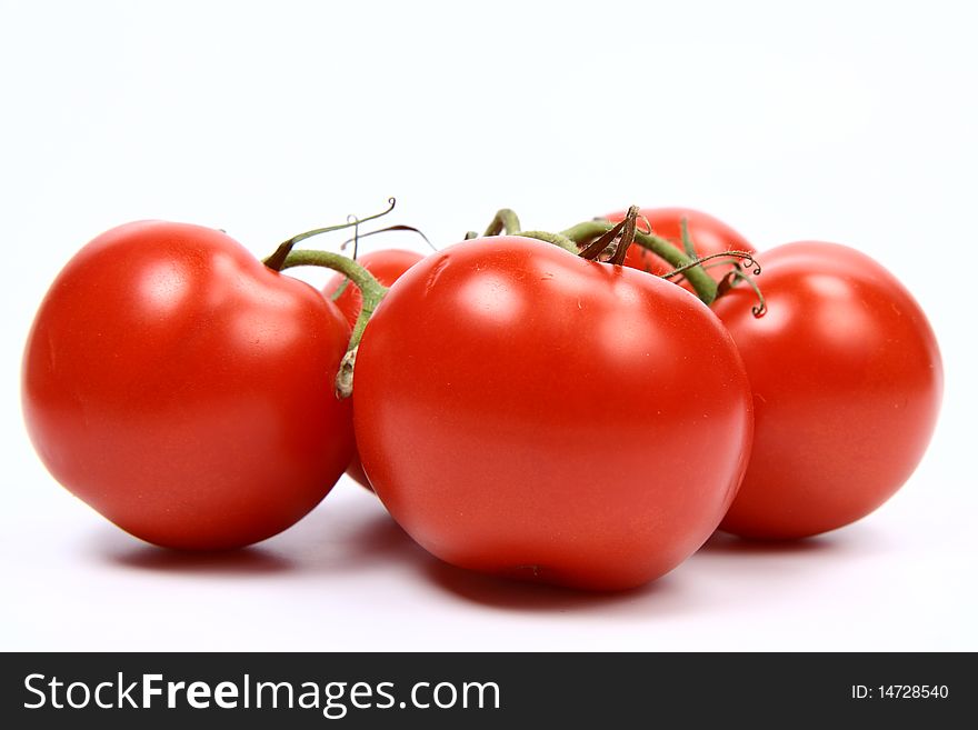 Bunch of tomatoes on white background