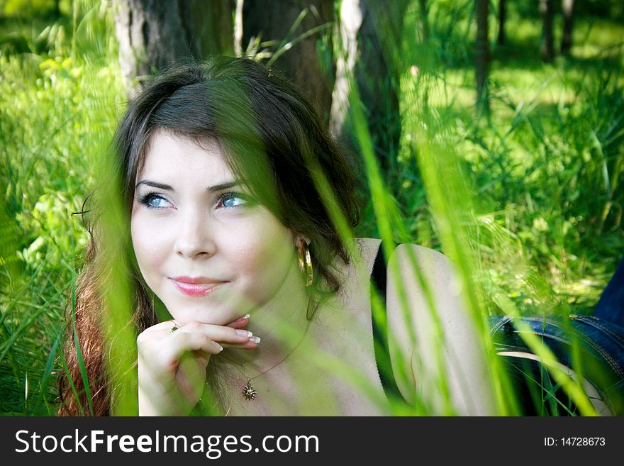 Young girl in the grass, weekend in the park