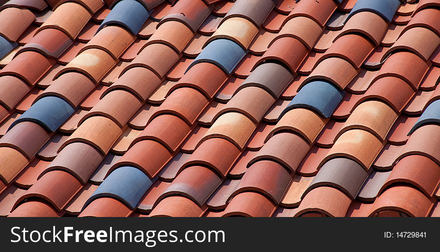 Colorful spanish tile roof which could be used for a background.