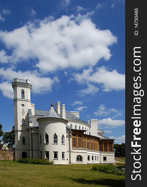 Gothic palace with the garden into a sunny day. Gothic palace with the garden into a sunny day