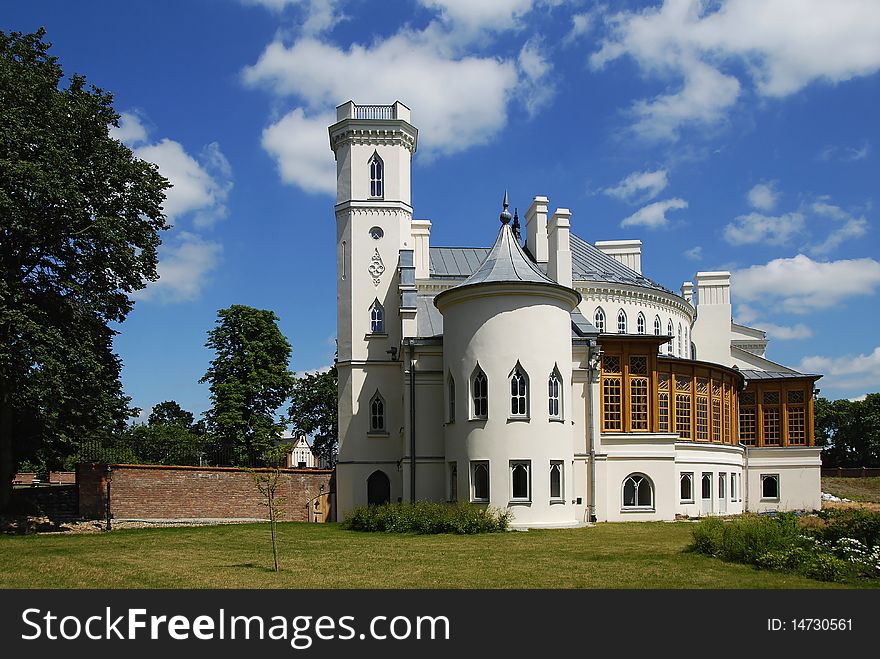 Gothic palace with the garden into a sunny day. Gothic palace with the garden into a sunny day