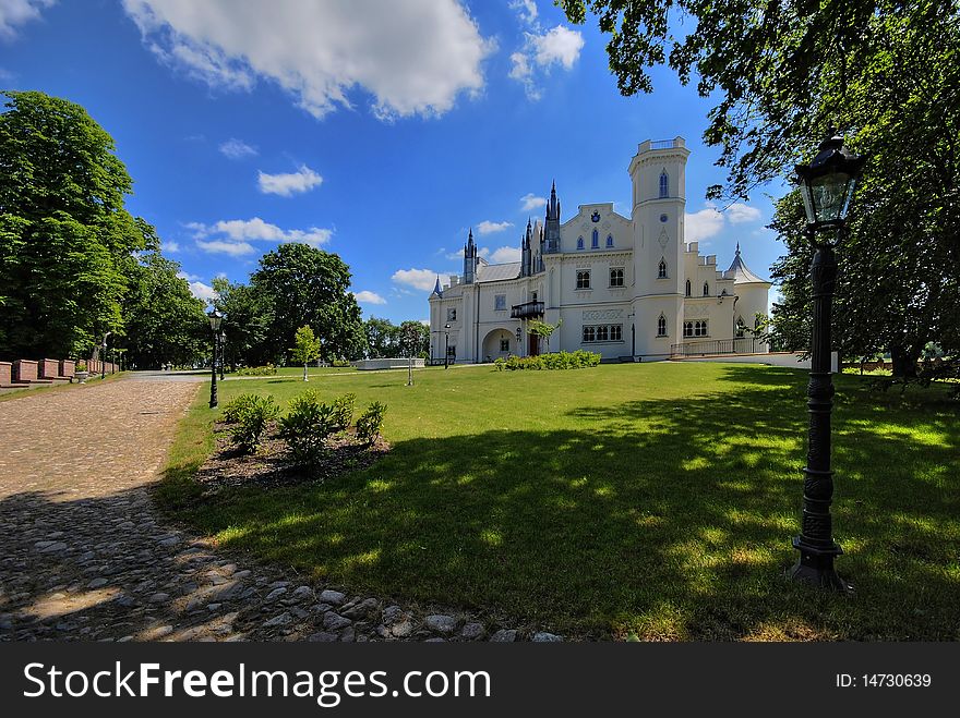 Gothic palace with the garden into a sunny day. Gothic palace with the garden into a sunny day