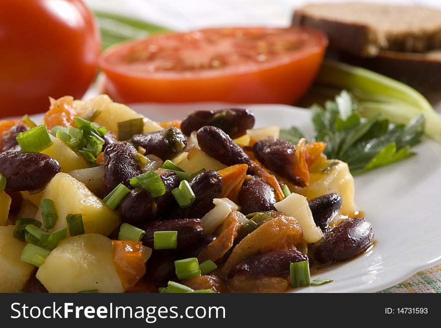 Salad with tomatoes, potatoes and beans, chinese dish. Salad with tomatoes, potatoes and beans, chinese dish