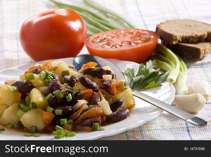 Salad with tomatoes, potatoes and beans, chinese dish. Salad with tomatoes, potatoes and beans, chinese dish