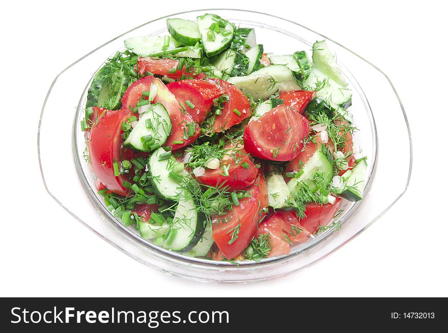 Salad made of fresh tomatoes, cucumbers and parsley.