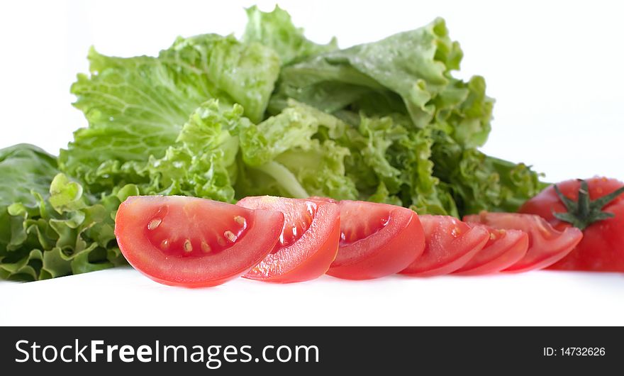 Tomato with salad, isolated on white. Tomato with salad, isolated on white