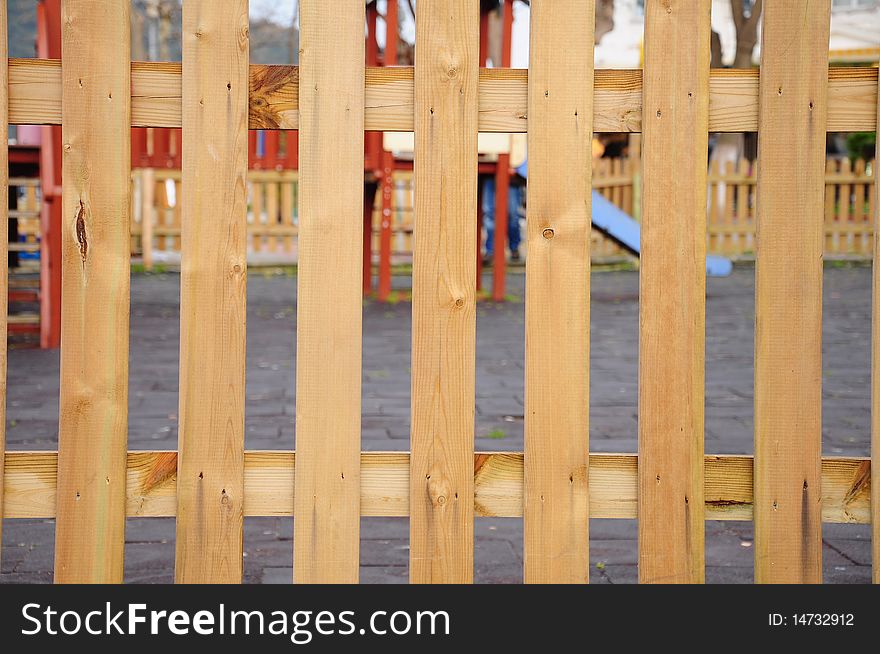 Wooden fence surrounding play ground