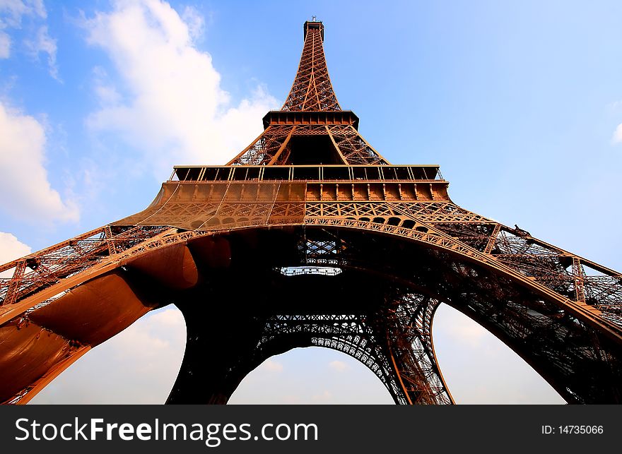 Eiffel tower in Paris with gorgeous colors and wide angle central perspective. Eiffel tower in Paris with gorgeous colors and wide angle central perspective.