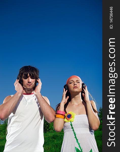 Boy and girl in headphones