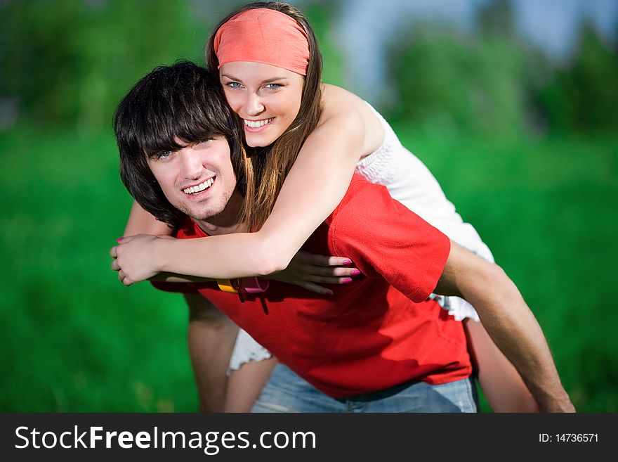 Beautiful girl and boy on green background