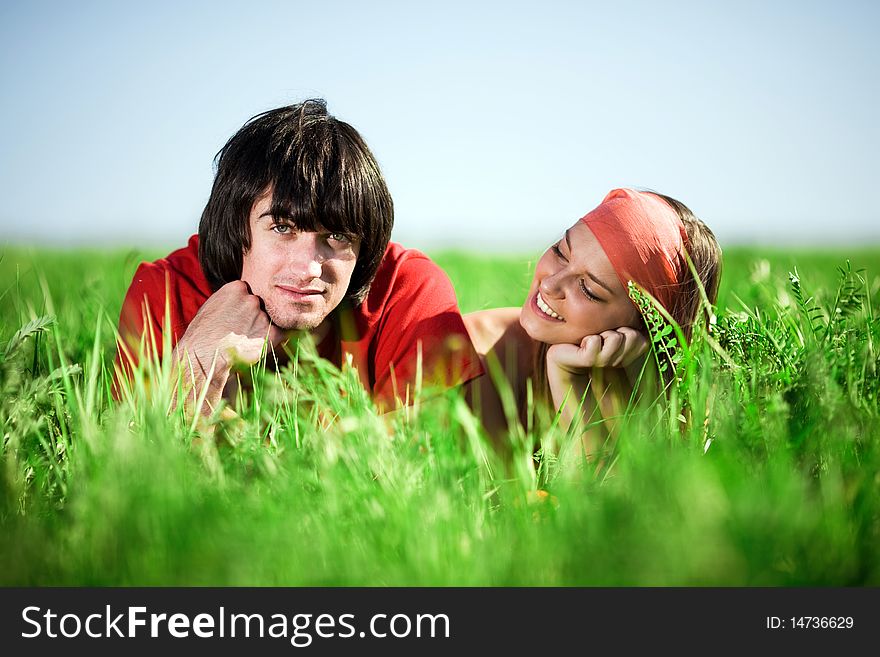 Girl with smile and boy on grass. Girl with smile and boy on grass