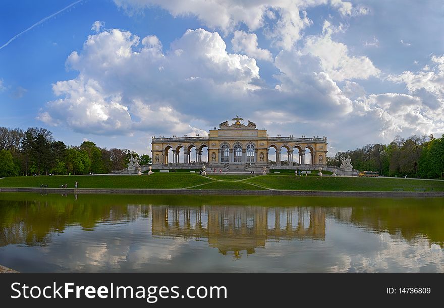 Schonbrunn, Pavilion Glorietta reflected in a pond at sunset, the sky clouds