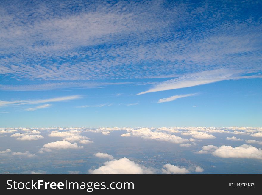 Between the layers of clouds.