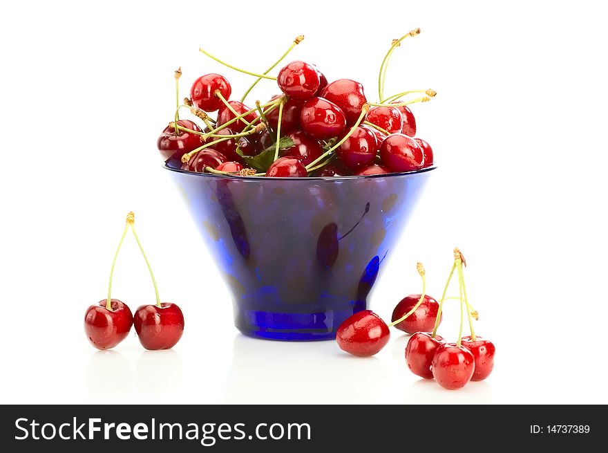Lot of cherries in the blue bowl. Lot of cherries in the blue bowl