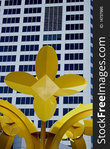Yellow Urban Flower with a city abstract back ground building. Yellow Urban Flower with a city abstract back ground building