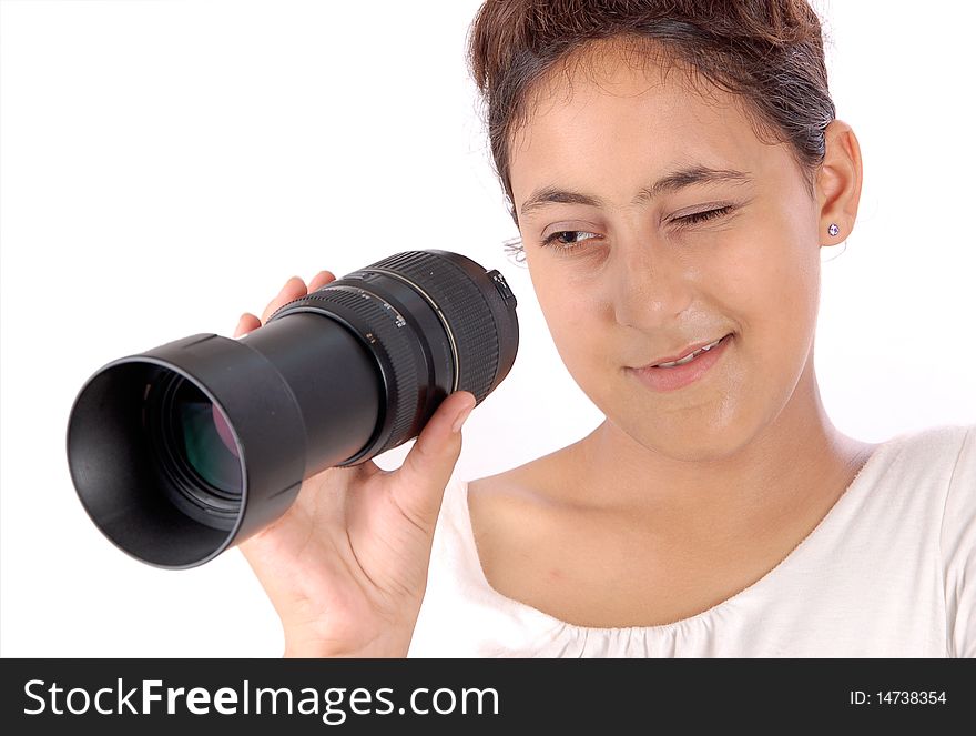 Girl looking through lens isolated on white