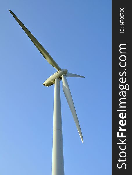 Wind turbines under the summer blue sky