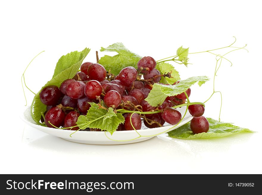 Grape on plate isolated white