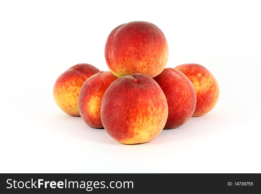 Fresh colorful ripe peaches isolated on white