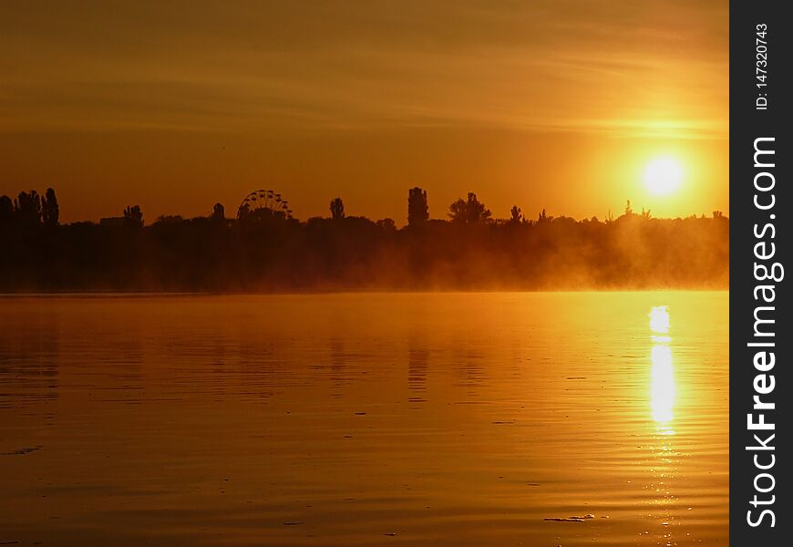 Dawn on the water. Mist over the water. Nature.